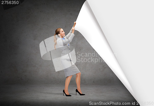 Image of smiling businesswoman changing sceneries