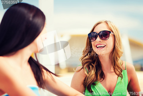 Image of girl in shades in cafe on the beach