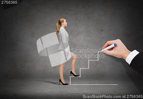 Image of businesswoman stepping up staircase