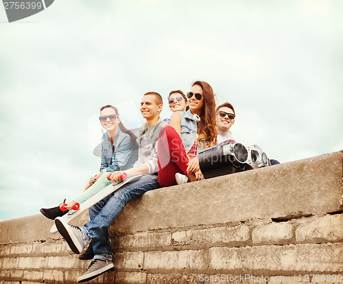 Image of group of teenagers hanging outside