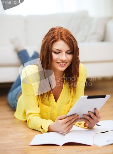 Image of student with tablet pc computer and notebooks