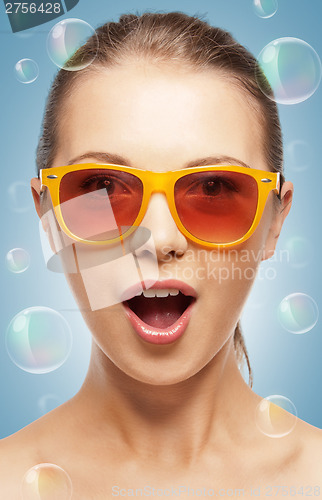 Image of surprised teenage girl in shades