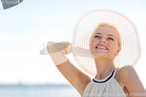 Image of beautiful woman enjoying summer outdoors