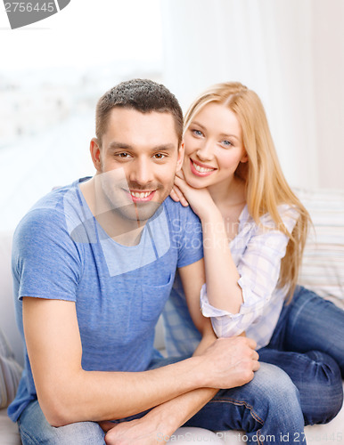 Image of smiling happy couple at home