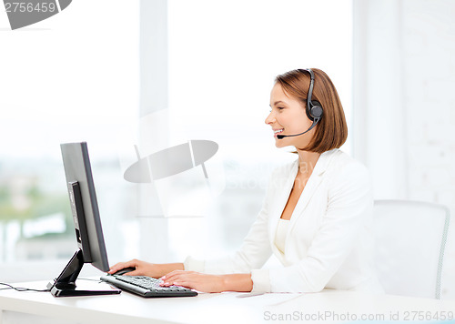 Image of friendly female helpline operator with computer