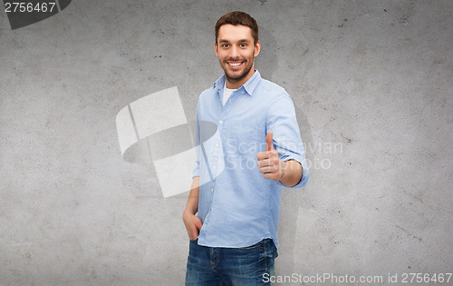 Image of smiling man showing thumbs up