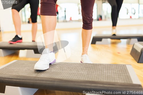 Image of close up of women legs steping on step platform