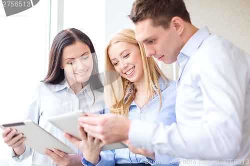 Image of business team working with tablet pcs in office