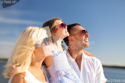 Image of happy family with blue sky