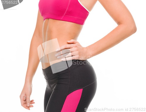Image of close up of female abs in sportswear