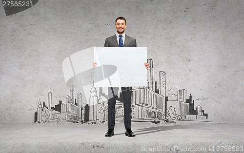 Image of smiling businessman with white blank board