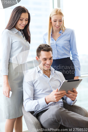 Image of business team working with tablet pc in office