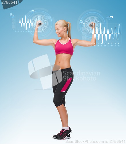 Image of young sporty woman with light dumbbells