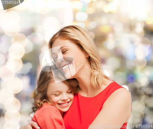 Image of hugging mother and daughter