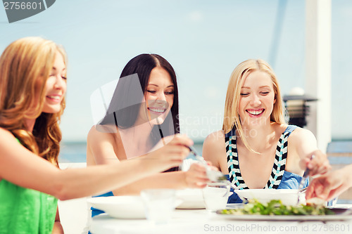 Image of girls in cafe on the beach