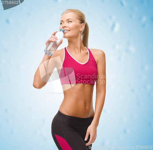 Image of smiling woman with bottle of water