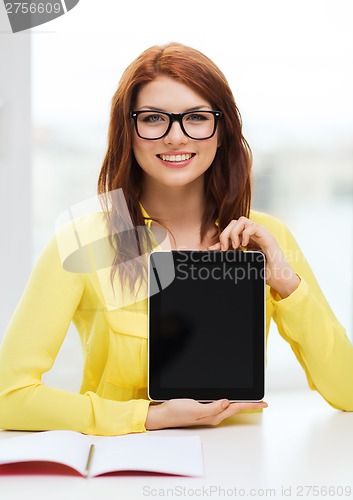 Image of smiling student girl in eyelgasses with tablet pc