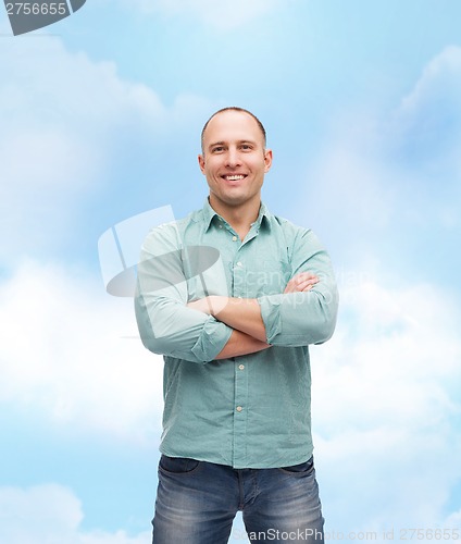 Image of smiling man with crossed arms