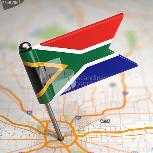 Image of South Africa Small Flag on a Map Background.