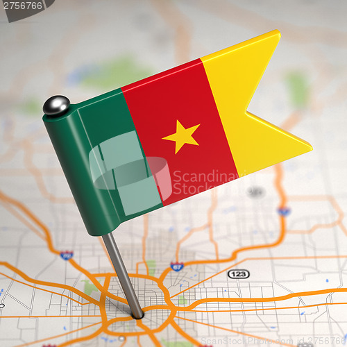 Image of Cameroon Small Flag on a Map Background.