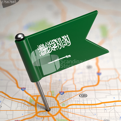 Image of Saudi Arabia Small Flag on a Map Background.