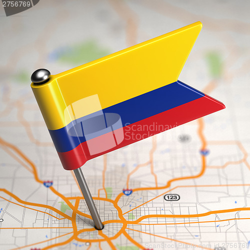 Image of Colombia Small Flag on a Map Background.