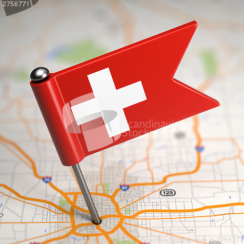 Image of Switzerland Small Flag on a Map Background.