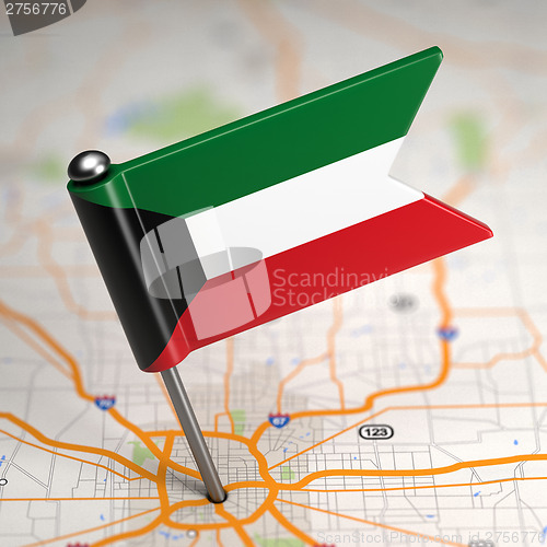 Image of Kuwait Small Flag on a Map Background.