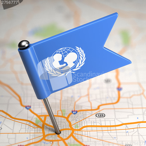 Image of UNICEF Small Flag on a Map Background.