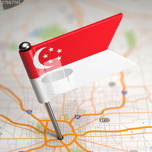 Image of Singapore Small Flag on a Map Background.