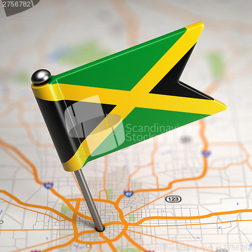 Image of Jamaica Small Flag on a Map Background.