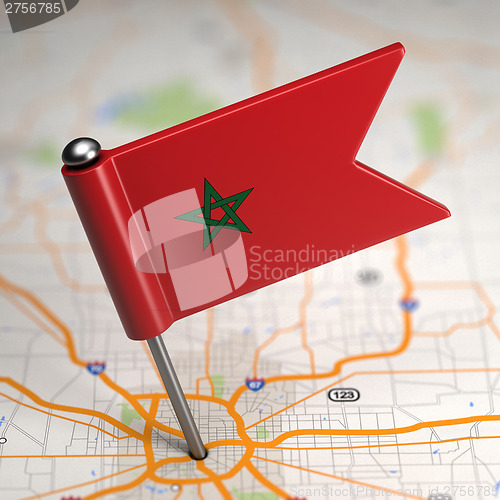 Image of Morocco Small Flag on a Map Background.