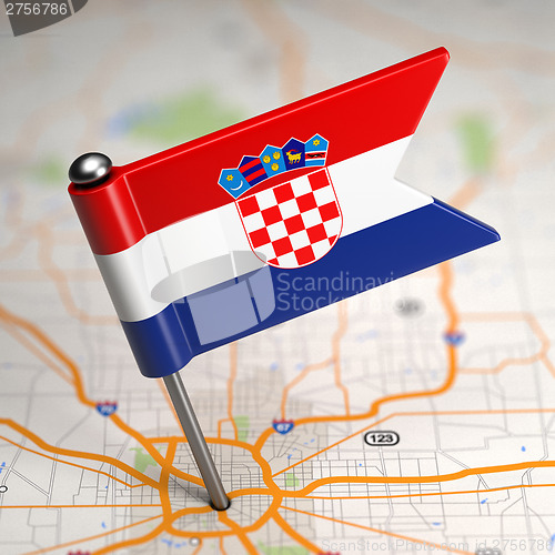 Image of Croatia Small Flag on a Map Background.