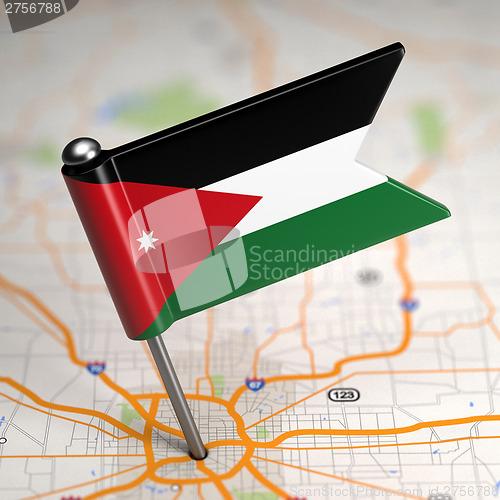 Image of Jordan Small Flag on a Map Background.