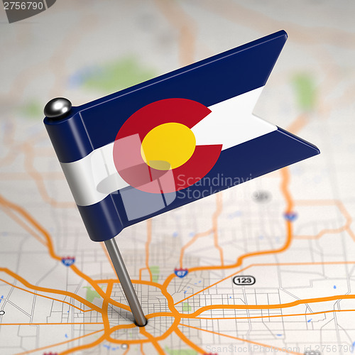 Image of Colorado Small Flag on a Map Background.