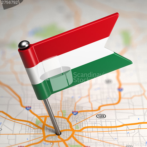 Image of Hungary Small Flag on a Map Background.