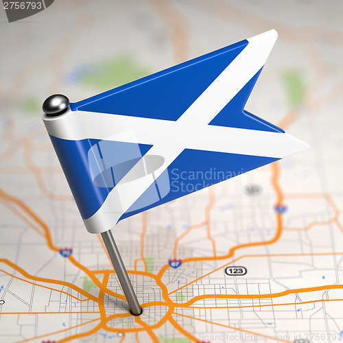 Image of Scotland Small Flag on a Map Background.
