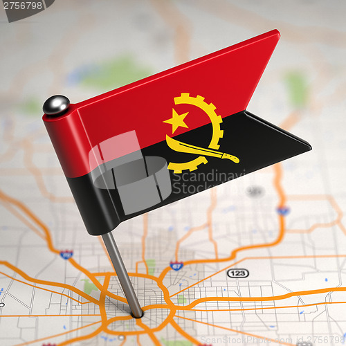 Image of Angola Small Flag on a Map Background.