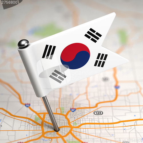 Image of South Korea Small Flag on a Map Background.