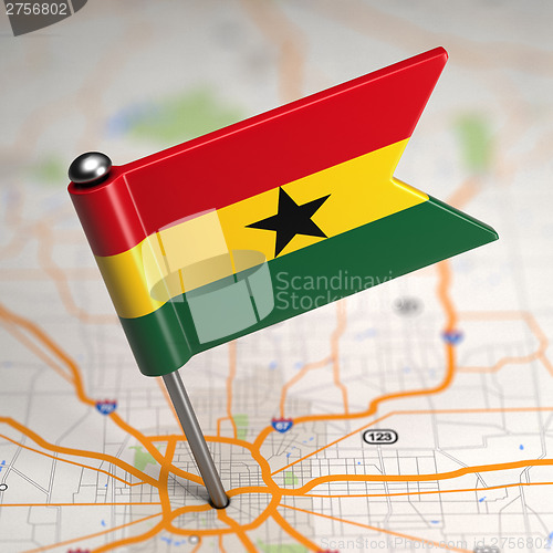 Image of Ghana Small Flag on a Map Background.