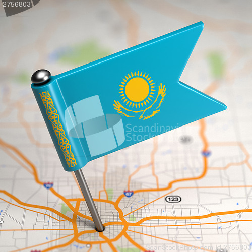 Image of Kazakhstan Small Flag on a Map Background.