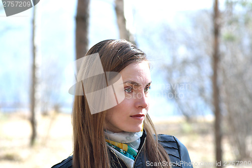 Image of Woman black leather jacket in the park