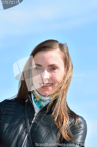 Image of Portrait of a woman on the sky background