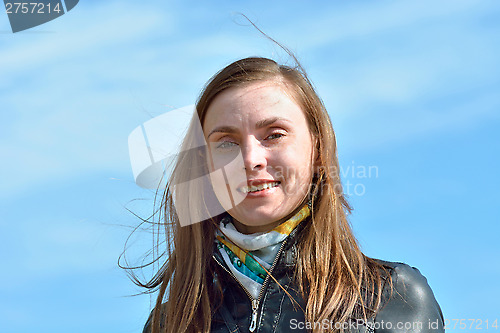 Image of Portrait of a woman on the sky background