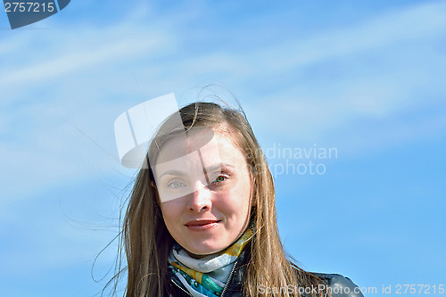 Image of Portrait of a woman on the sky background