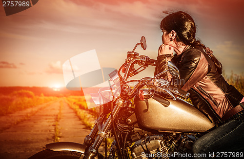 Image of Biker girl on a motorcycle