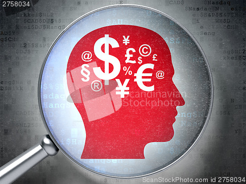Image of Marketing concept:  Head With Finance Symbol with optical glass