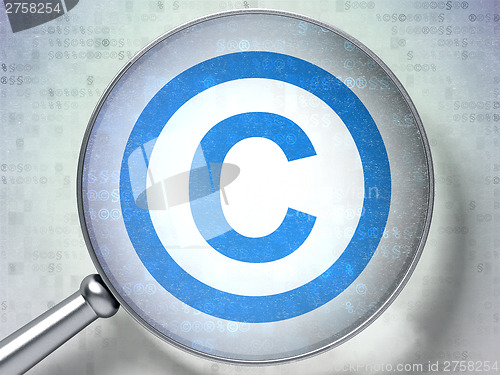 Image of Law concept:  Copyright with optical glass on digital background