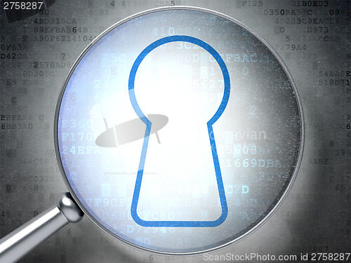 Image of Information concept:  Keyhole with optical glass on digital back