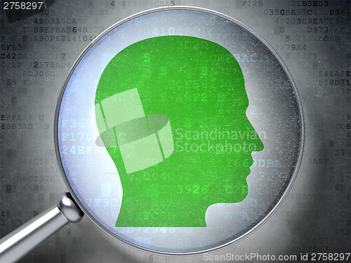 Image of Information concept:  Head with optical glass on digital backgro